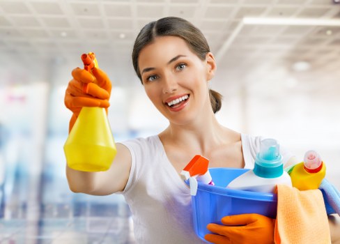Local carpet cleaner treating stains in a family living room